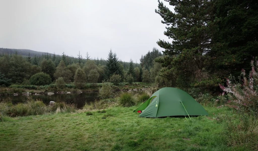 Tent pitched next to the river