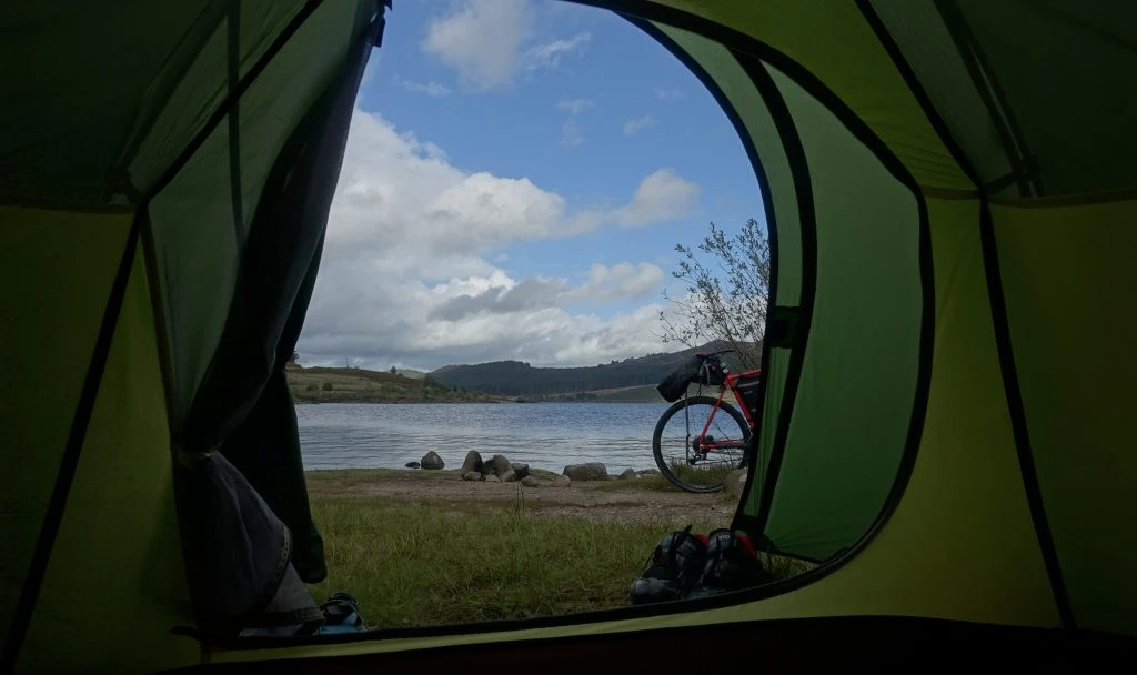 View out of the tent door over Loch Doon